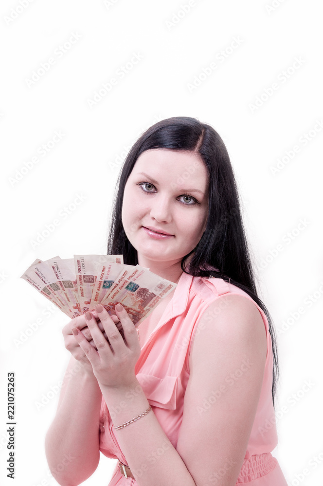 Brunette girl in pink blouse holding money in hands Brunette girl in pink blouse holding money in hands