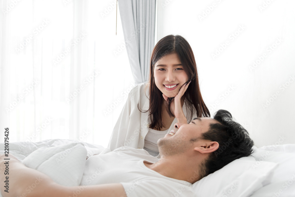 Romantic couple on bed and looking at each other together, lifestyle concept. Romantic couple on bed and looking at each other together, lifestyle concept.