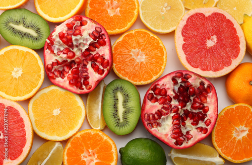 healthy food. mix sliced lemon, green lime, orange, mandarin, kiwi fruit and grapefruit isolated on white background. top view