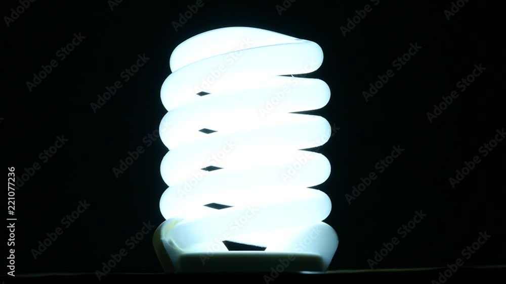 fluorescent lamp turning on and off on black background, slow motion fluorescent lamp turning on and off on black background, slow motion