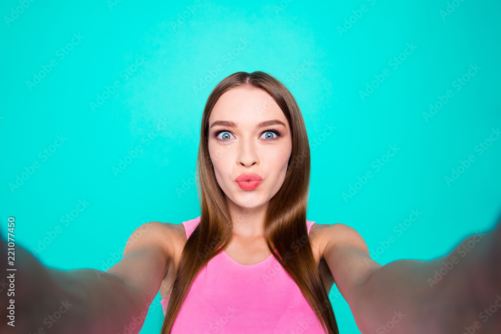 Young hipster model girl makes selfie on the front camera of her Young hipster model girl makes selfie on the front camera of her