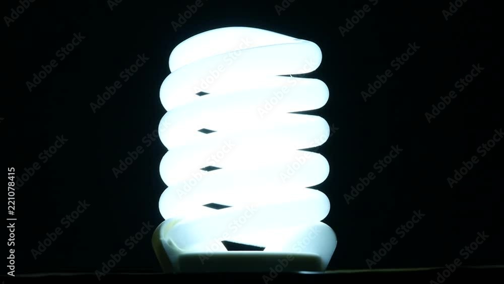 fluorescent lamp turning on and off on black background, slow motion fluorescent lamp turning on and off on black background, slow motion