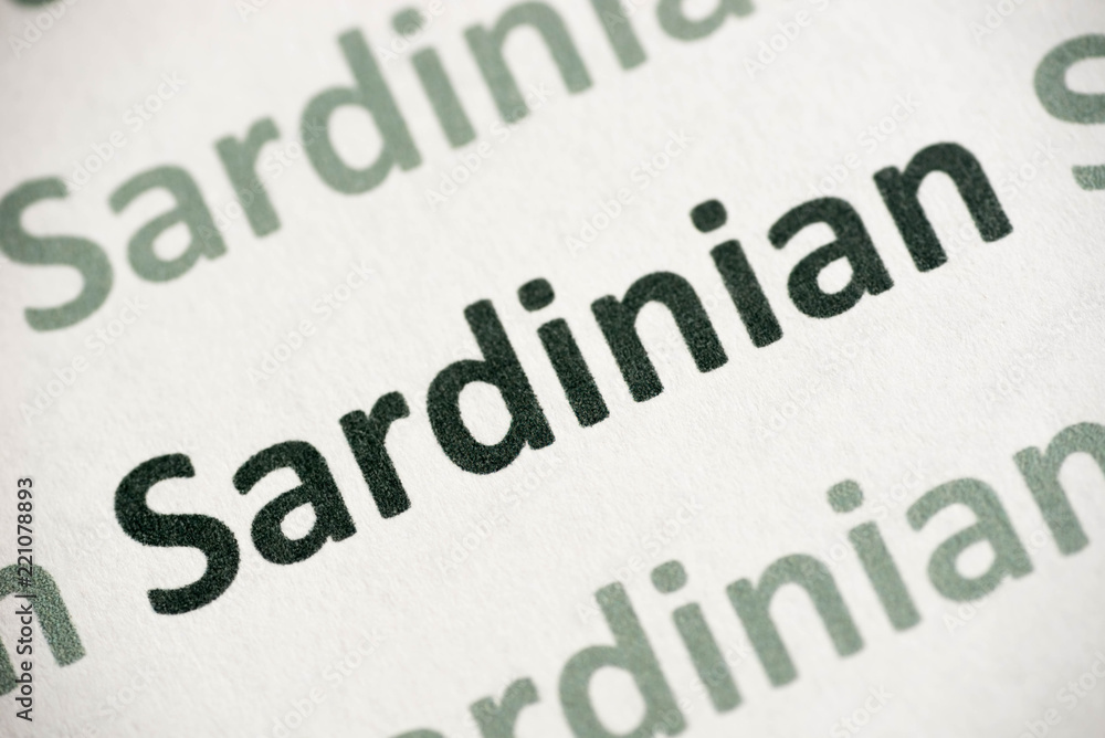 word Sardinian language printed on paper macro word Sardinian language printed on paper macro