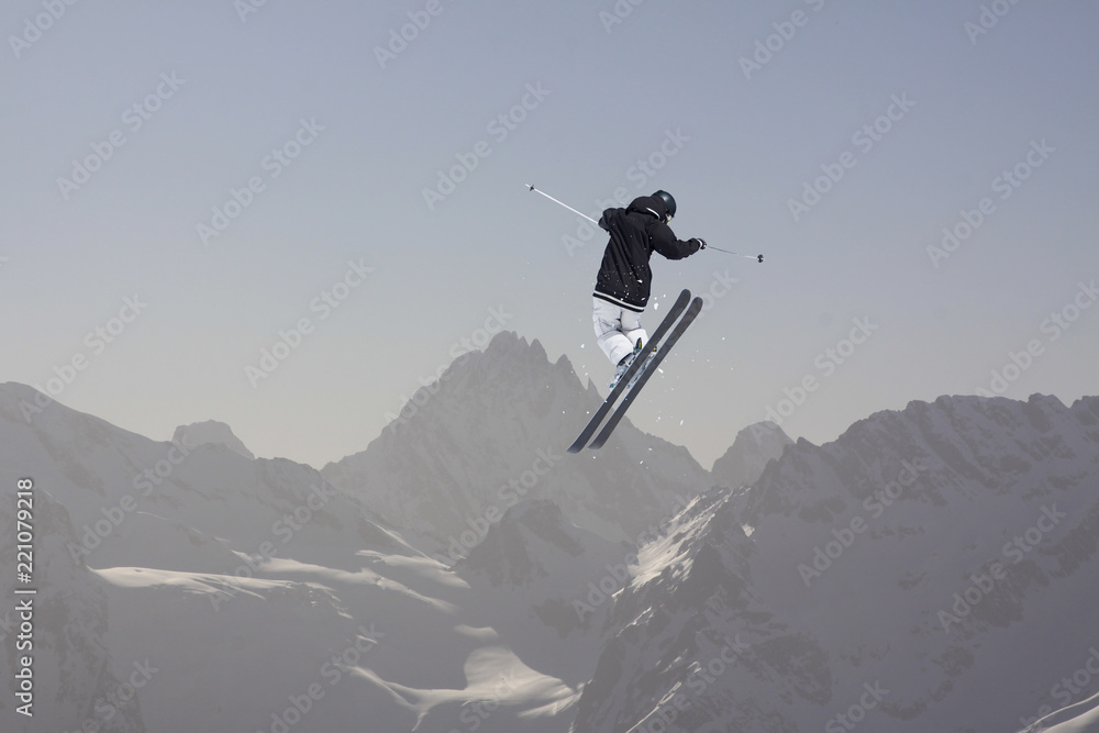 Flying skier on mountains. Extreme winter sport. Flying skier on mountains. Extreme winter sport.