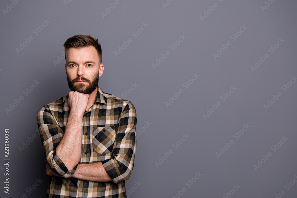 Young handsome brunet isolated on gray background with copy spac Young handsome brunet isolated on gray background with copy spac