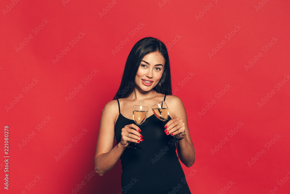 Happy New Year to you. One young and beautiful woman dancing with glass of champagne Happy New Year to you. One young and beautiful woman dancing with glass of champagne