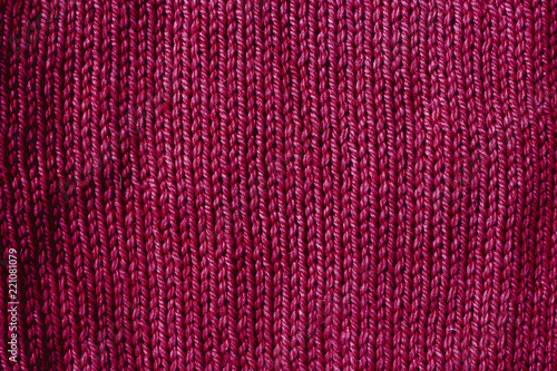 trend red pear woolen knitted background, texture, close-up