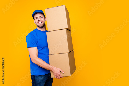 Portrait of handsome attractive funny bearded deliver in blue un photo