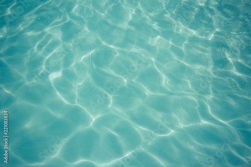 light blue water texture pattern in swimming pool