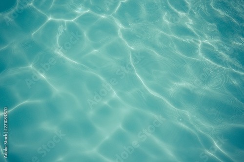 light blue water texture pattern in swimming pool