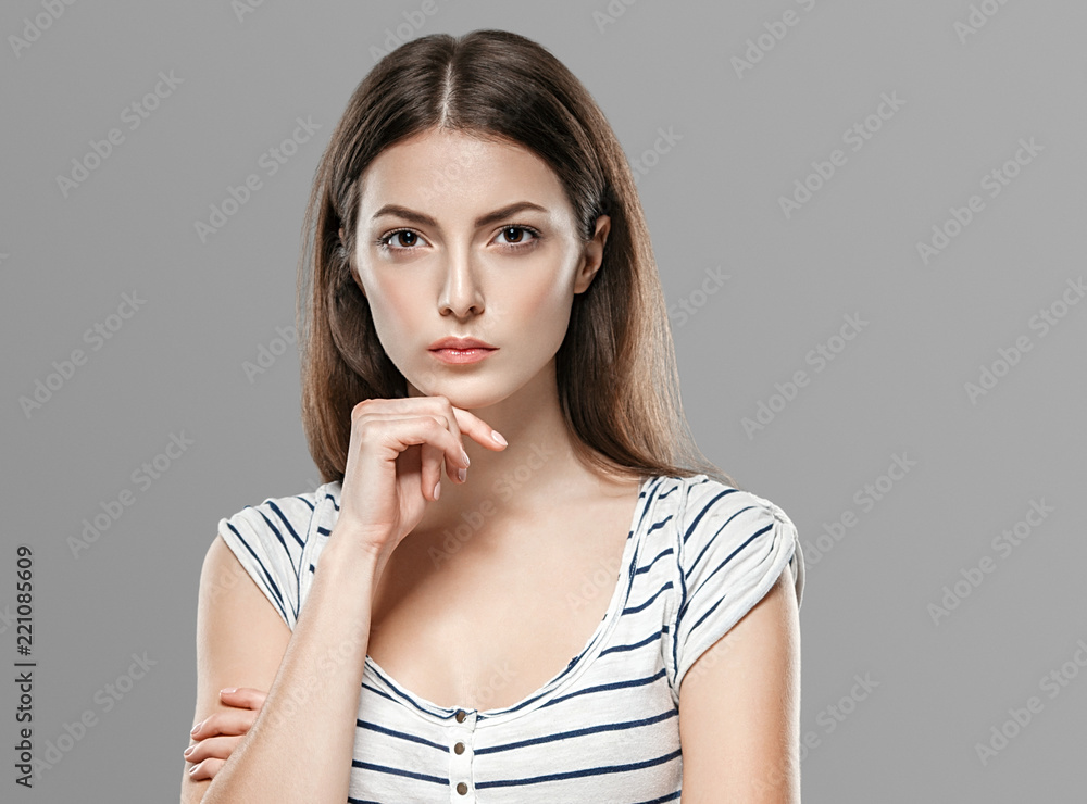 Healthy skin woman beautiful face close up over gray background Healthy skin woman beautiful face close up over gray background