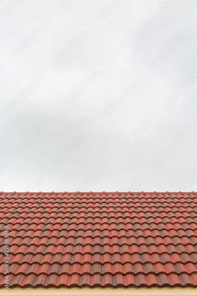 Roof tile pattern over sky background Roof tile pattern over sky background