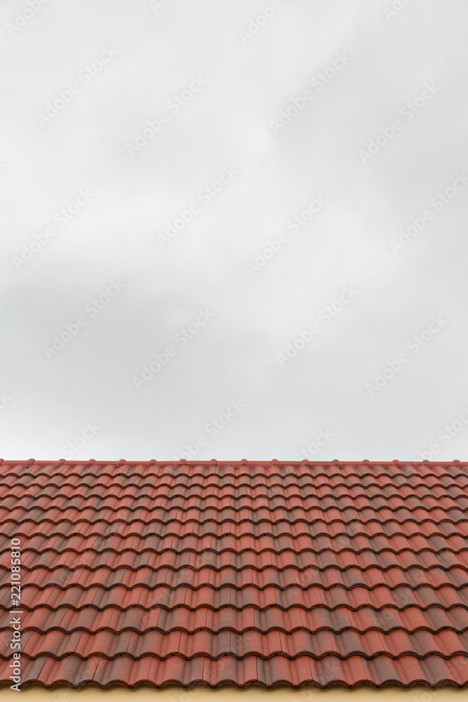 Roof tile pattern over sky background Roof tile pattern over sky background