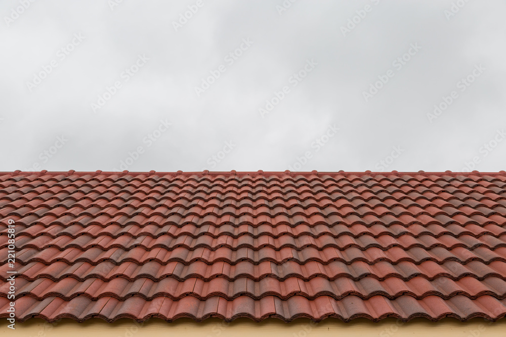 Roof tile pattern over sky background Roof tile pattern over sky background