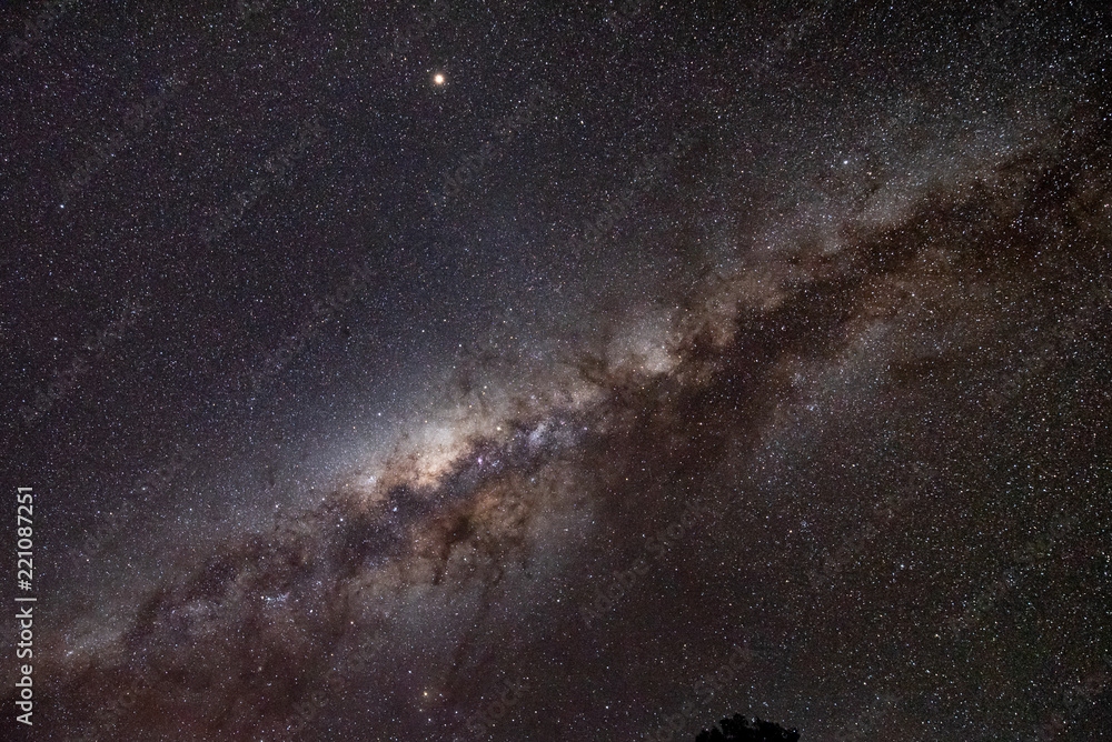 Obraz premium Milky way in clear night sky. Milky Way is the galaxy that contains our Solar System. The descriptor 