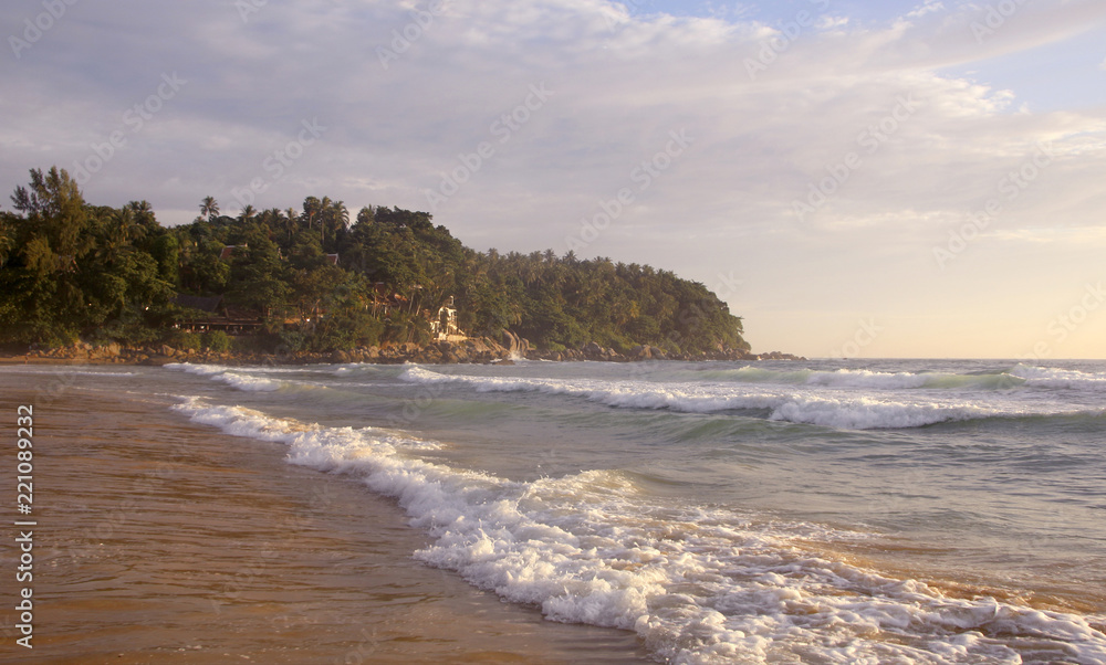Beautiful sunset on Karon beach. The surf pounds the shore. Phuket, Thailand Beautiful sunset on Karon beach. The surf pounds the shore. Phuket, Thailand