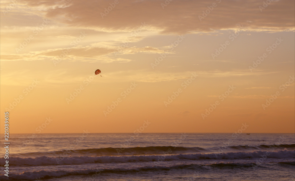Beautiful sunset on Karon beach. The surf pounds the shore. Phuket, Thailand Beautiful sunset on Karon beach. The surf pounds the shore. Phuket, Thailand