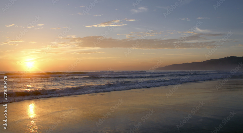 Beautiful sunset on Karon beach. The surf pounds the shore. Phuket, Thailand Beautiful sunset on Karon beach. The surf pounds the shore. Phuket, Thailand