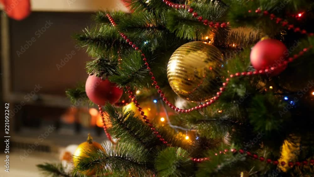 custom made wallpaper toronto digitalCloseup 4k footage of beautiful golden and red baubles hanging on Christmas tree decoraetd with glowing colorful lights and garlands. Perfect background for winter celebrations and holidays