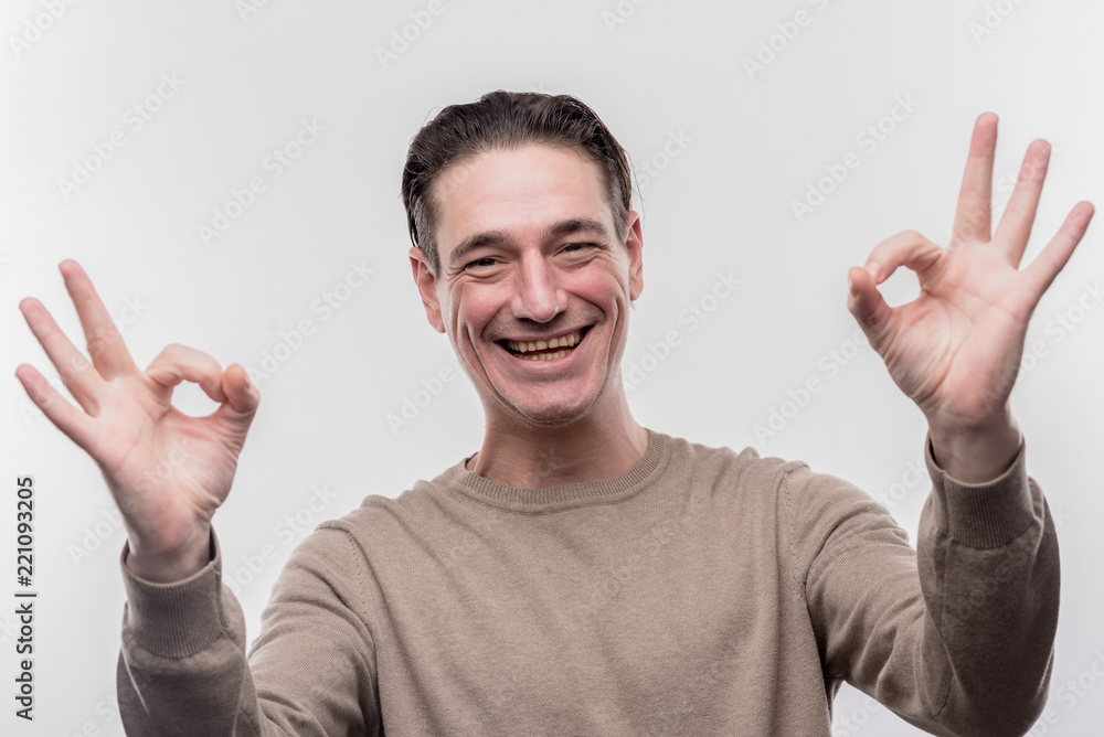 Beaming man. Beaming dark-haired man feeling extremely emotional and satisfied on image without face retouching Beaming man. Beaming dark-haired man feeling extremely emotional and satisfied on image without face retouching