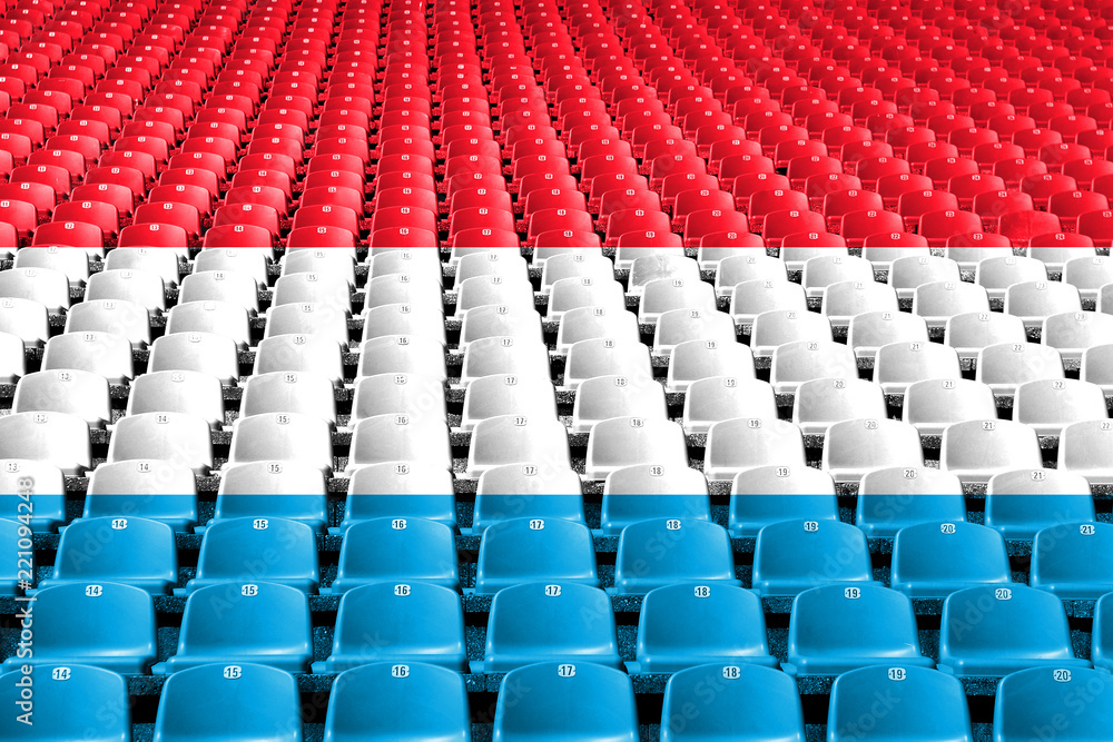 Fototapeta premium Siedziska stadionowe z flagą Luksemburga. Koncepcja konkurencji sportowych.