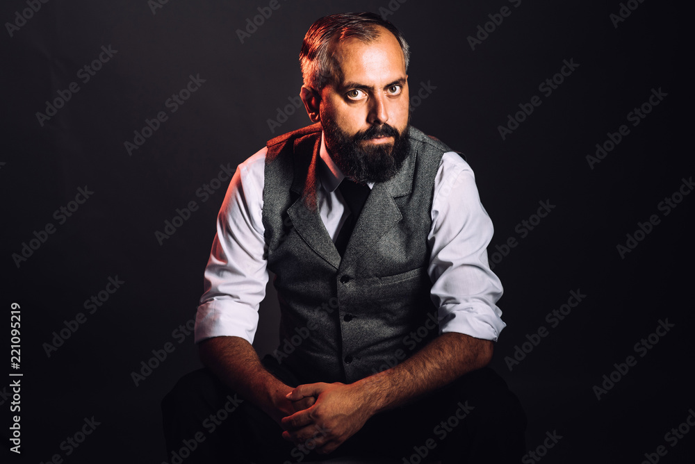 Very charismatic looking bearded man portrait in studio Very charismatic looking bearded man portrait in studio