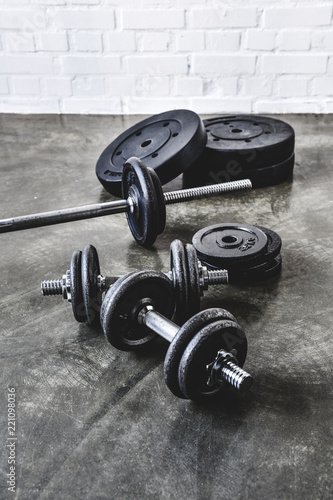 various gym equipment on concrete surface