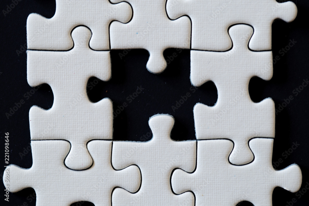 Close up of a white puzzle Close up of a white puzzle