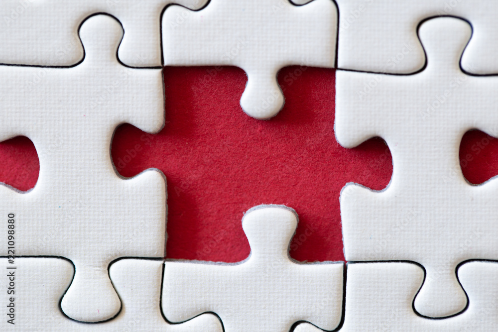 Missing puzzle piece on a red backgroung Missing puzzle piece on a red backgroung
