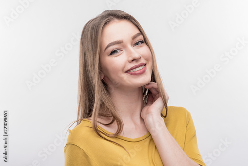 Beautiful girl. Image without face retouching with blonde-haired beautiful girl wearing stylish yellow blouse