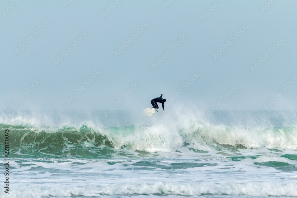 Wave jumping, Fistral beach, Newquay, Cornwall Wave jumping, Fistral beach, Newquay, Cornwall