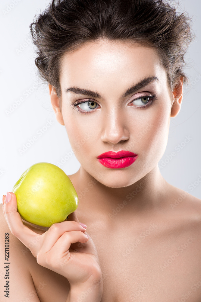 beautiful girl holding green apple, isolated on grey beautiful girl holding green apple, isolated on grey