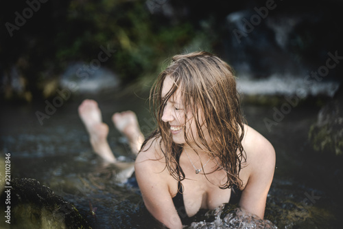young woman in water with bikini