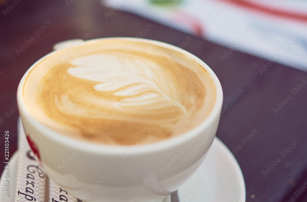 A cup of cappucino A cup of cappucino