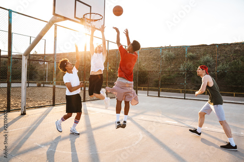 Group of young sporty multiethnic men basketball players © Drobot Dean