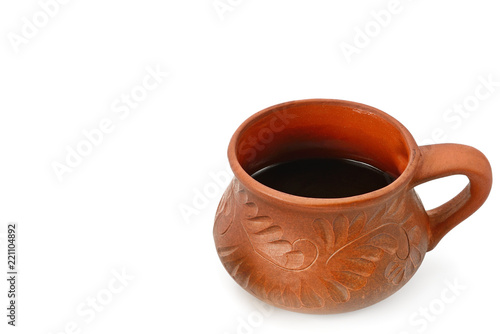Coffee in a clay cup isolated on white background. Free space for text. Free space for text.