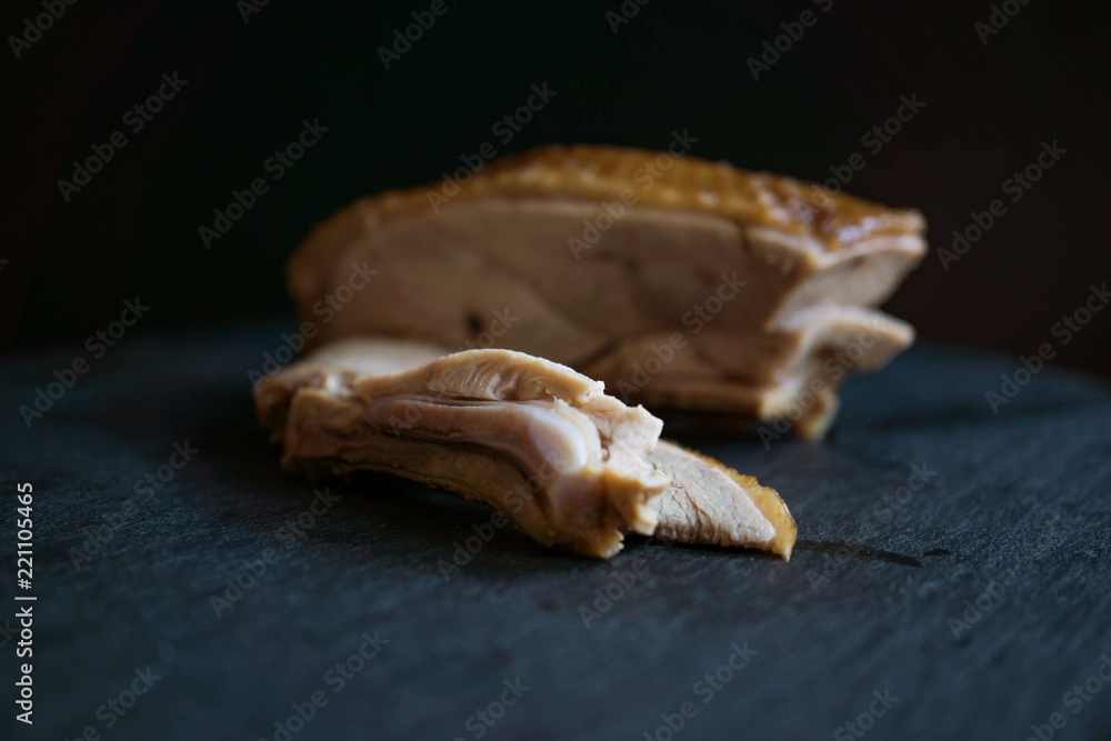 blur sliced of roasted duck meats in black background