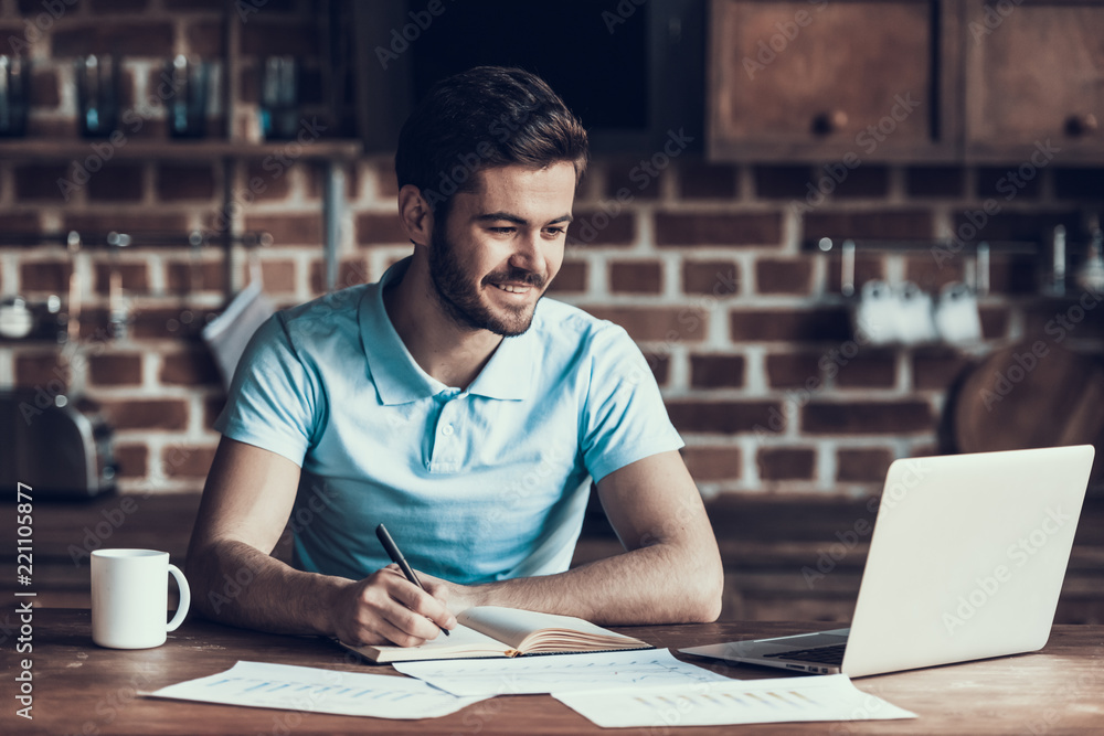 Obraz premium Handsome Businessman Working with Laptop Home