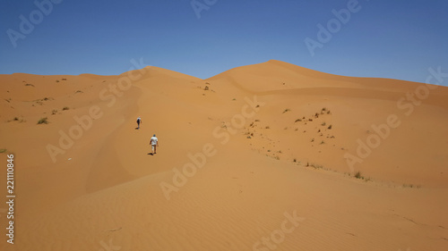Tourists walking in the dunes