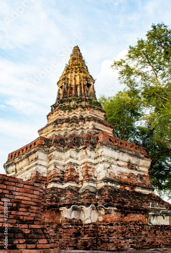 The old tower built of bricks is damaged at Worachet temple in Ayutthaya ,Thailand.