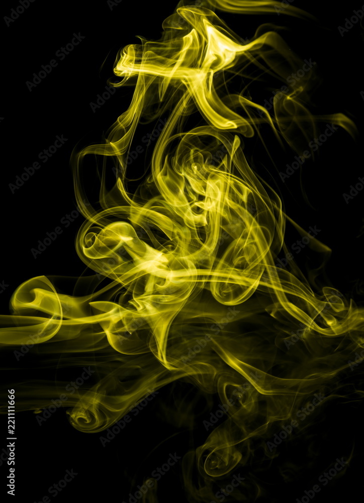 Fototapeta premium Yellow smoke on black background
