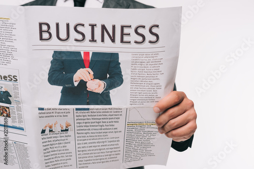 cropped image of businessman reading business newspaper isolated on white