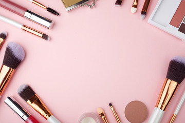 Fashion Makeup Cosmetic accessories on pink background. Top view. Flat lay.