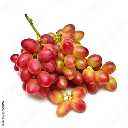 Fresh red grapes branch isolated on white background. Creative concept of fruit. Flat lay  top view. Pink bunch
