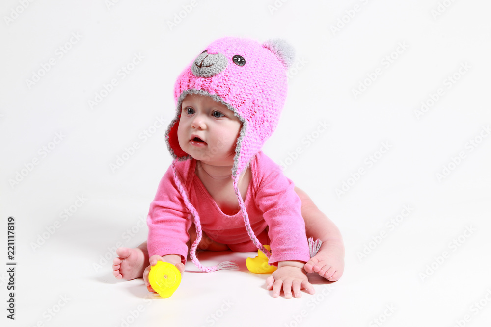 little girl is played with dents in the studio on a white background little girl is played with dents in the studio on a white background