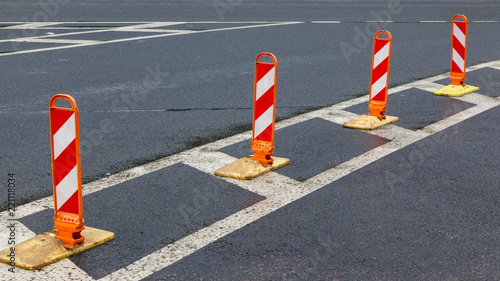 Traffic cones on asphalt road with white marking © Aleksey Sidorov