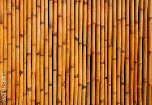 Fototapeta Naklejka Na Ścianę i Meble -  Bamboo mat background close up lines are vertical on a horizontal orientation shot from above,Bamboo fence or wall texture background.