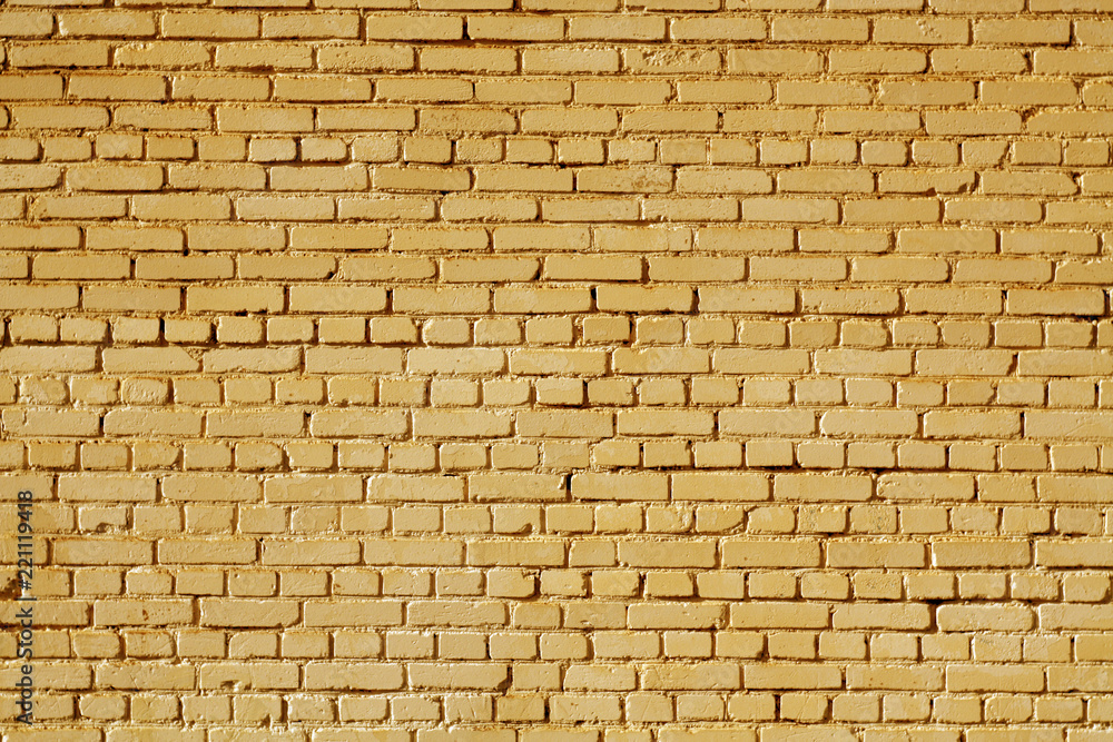 Fototapeta premium Orange color old grungy brick wall surface.
