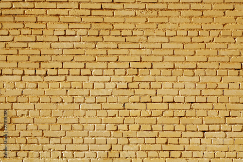 Orange color old grungy brick wall surface.