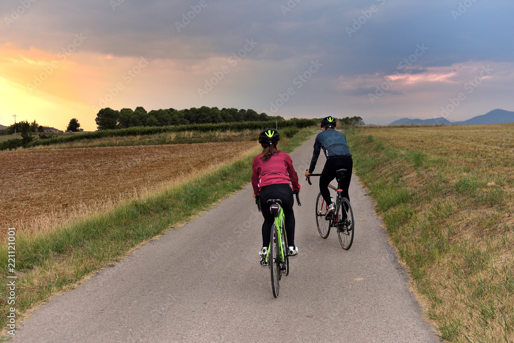 cycling couple on a road